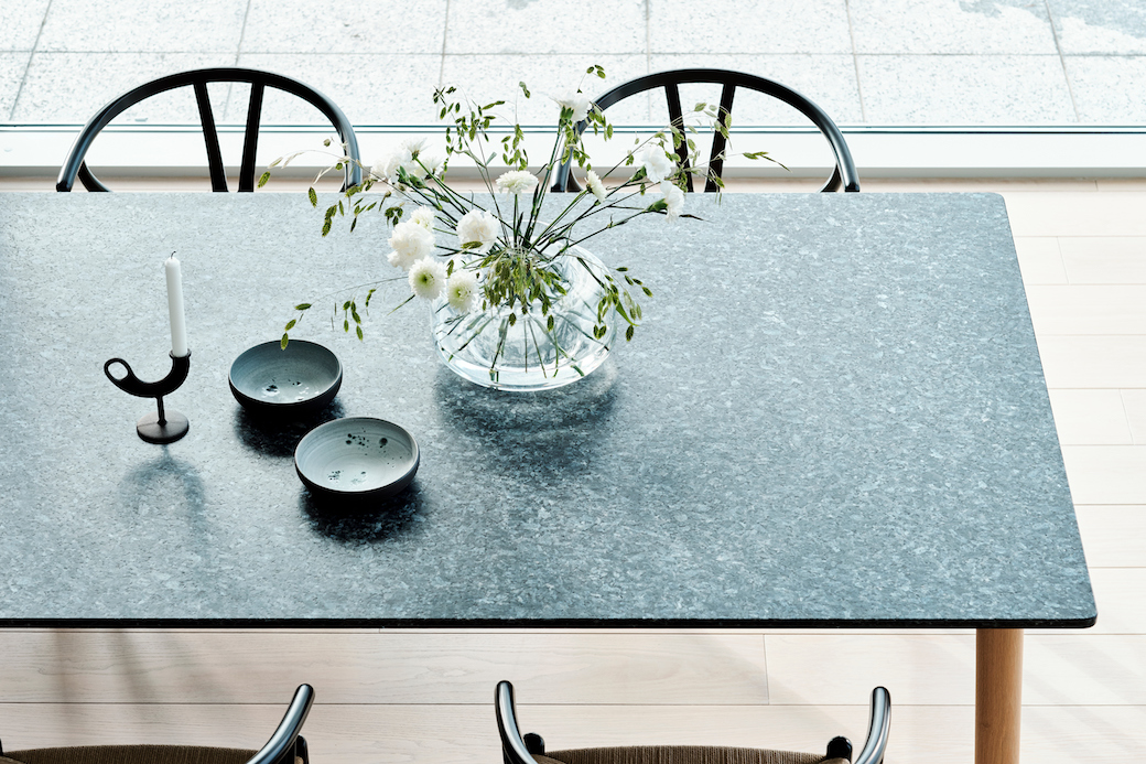 As Long As You Like dining table, by Jenkins & Uhnger, in Lundhs Blue stone.
